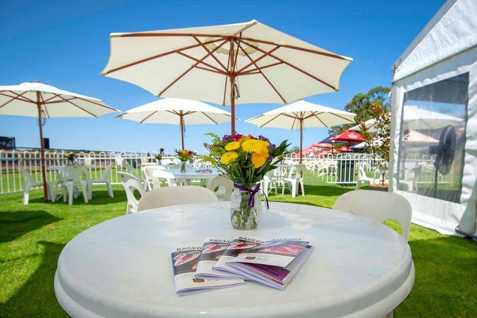 Marquee tables and umbrellas on Pinjarra Cup day